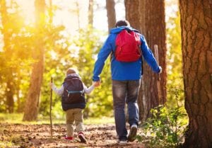 Man hiking with young child