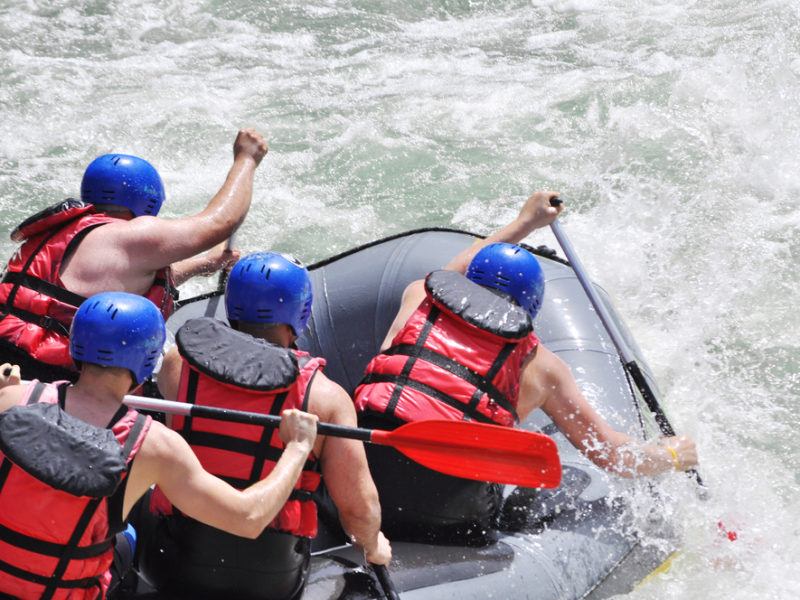 Whitewater rafting over rapids