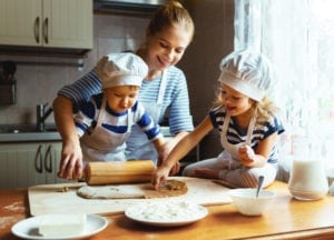 family baking in cabin